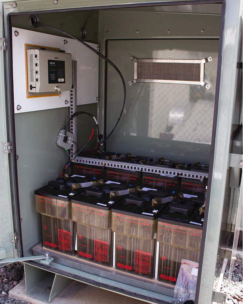 Outdoor battery storage unit with Eagle Eye Power Solutions BDS-Pro battery monitoring system on batteries