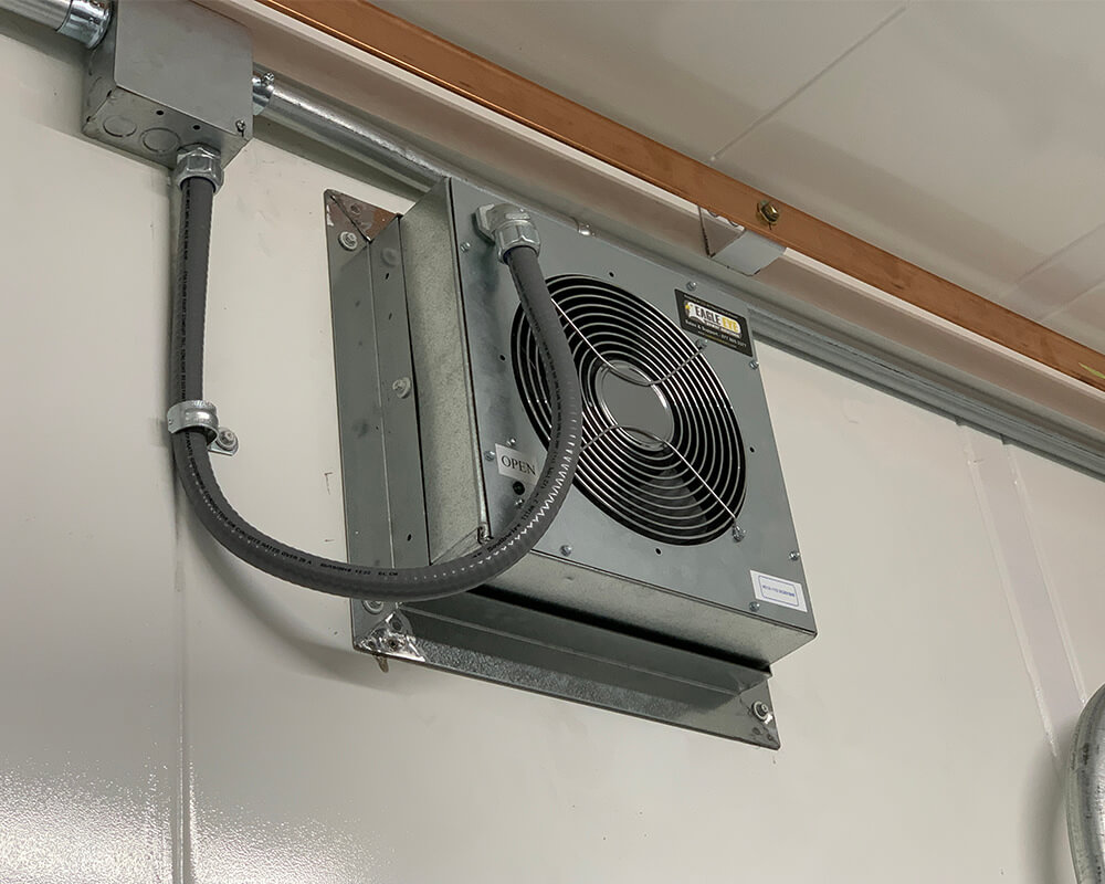 Inside view of an Eagle Eye Power Solutions gas and ventilation system mounted on a wall