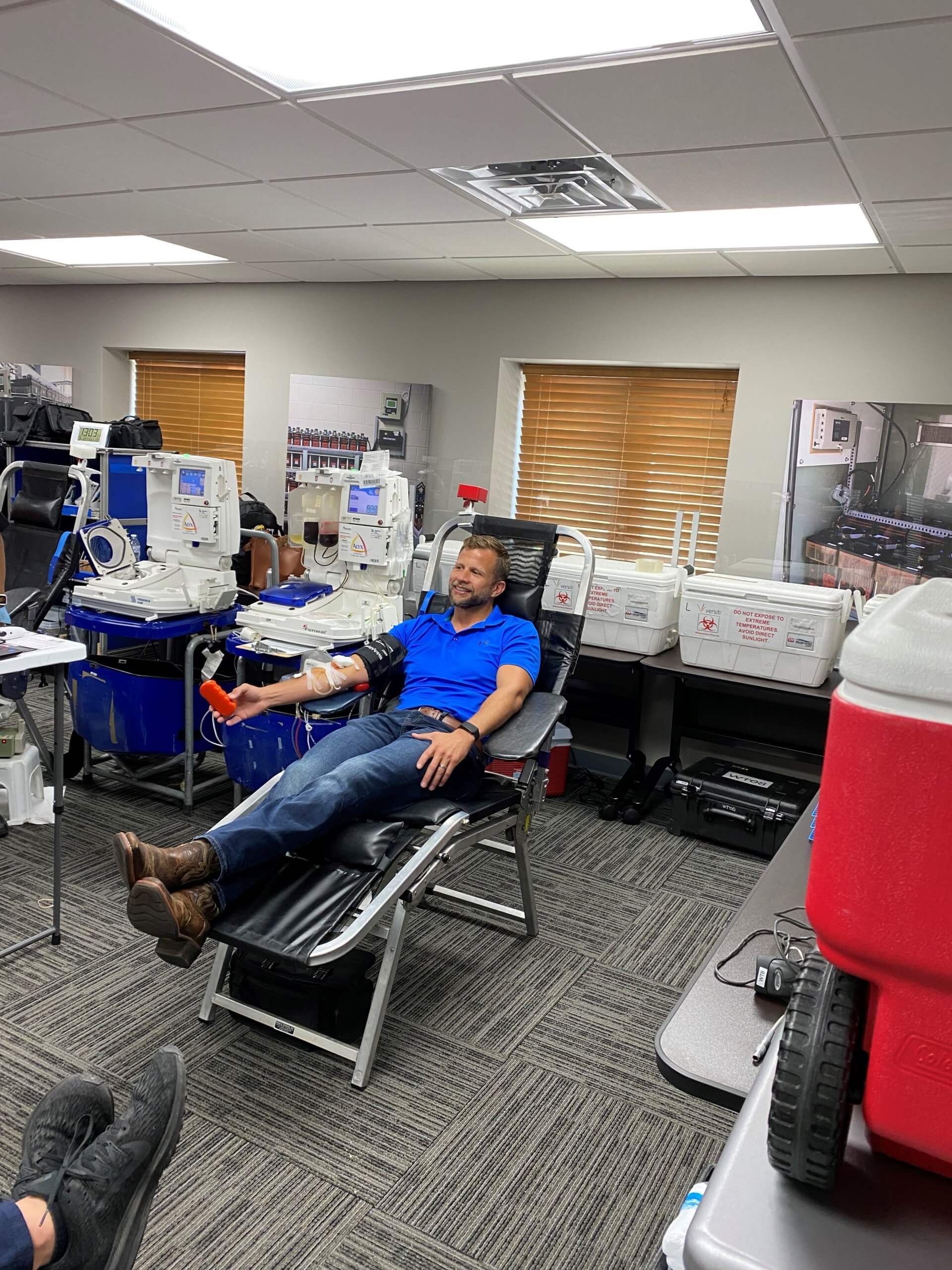 Ryan Sberna, Eagle Eye Power Solutions CEO & President donating blood at Eagle Eye Power Solutions annual blood drive.