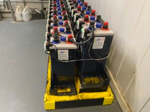 Side View: Eagle Eye Power Solutions Vigilant Battery Monitoring system and battery spill containment solution.