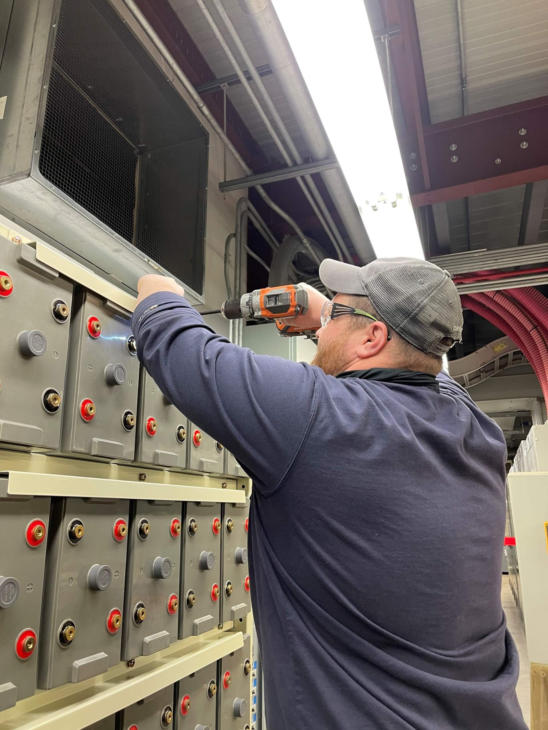 Eagle Eye Power Solutions battery service technician installing a battery system