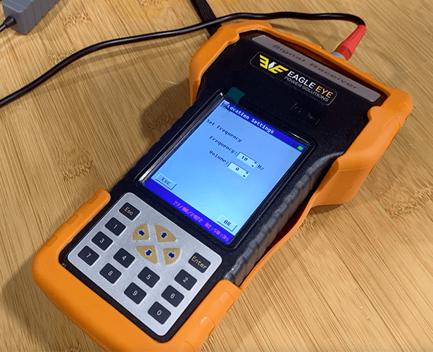 A GFL-1000 Ground Fault Locator and Detector with readings on screen.