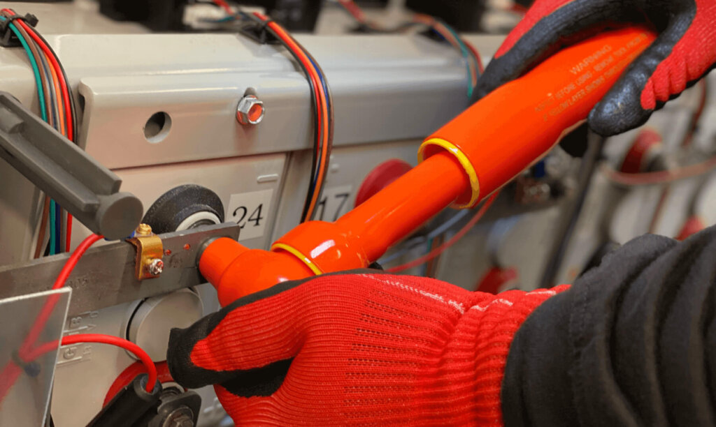 Eagle Eye Services technician first loosening then torquing a battery terminal connection.