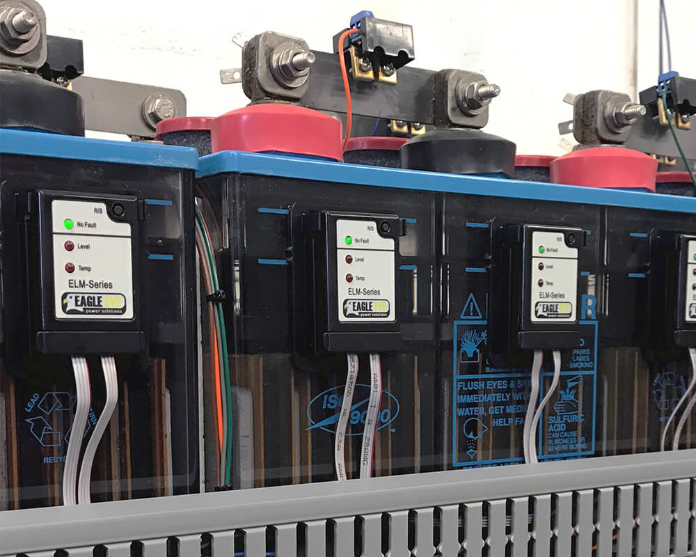 Close-up of Eagle Eye Power Solutions ELM-Series monitoring system sensors attached to batteries