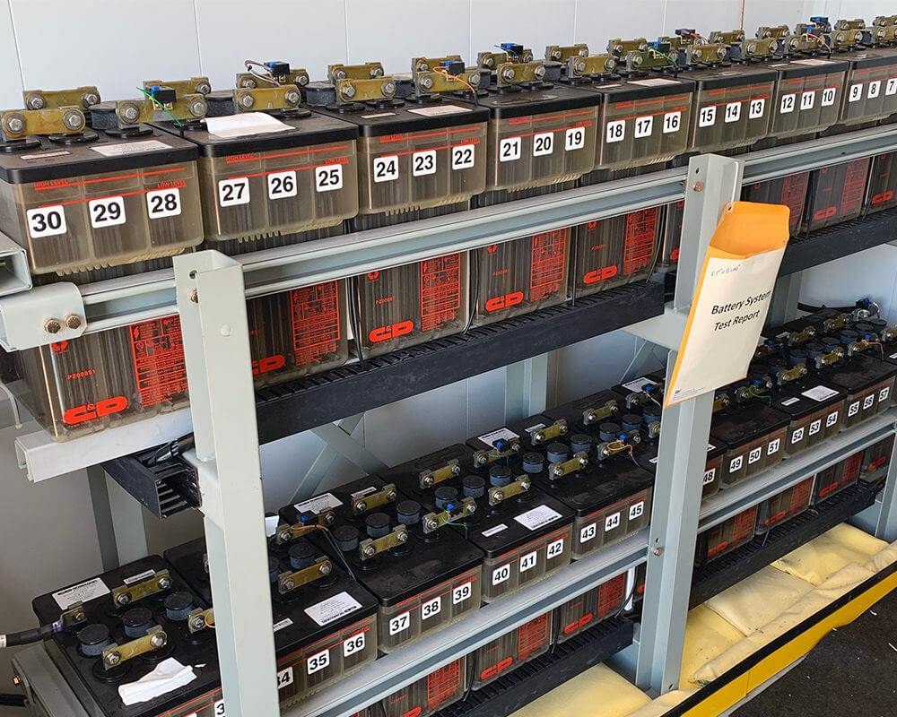 Two racks of batteries with Eagle Eye Power Solutions iPQMS battery monitor