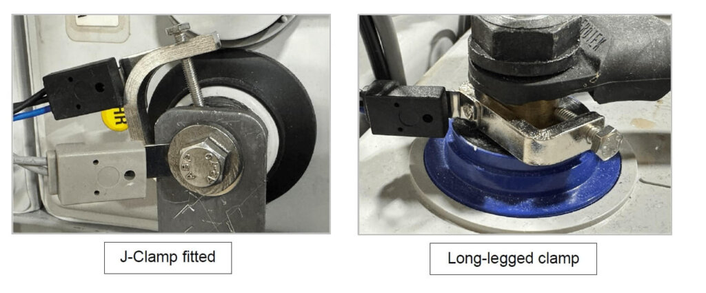 Two images showing different clamp installation methods for battery sensor connections. The left image shows a J-Clamp fitted securely to a bolt and tab washer. The right image shows a Long-legged clamp installed on a battery post with a ring terminal connection. Both clamps are used for connecting Vigilant® battery monitoring sensors.