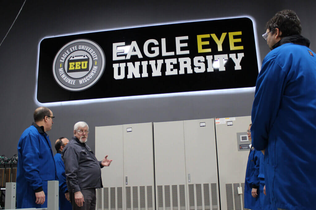 EEU Instructor, George Pedersen, in the EEU battery lab teaching students.