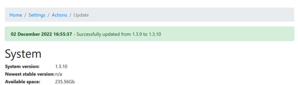 Screenshot of a system update confirmation page showing a green success message: "02 December 2022 16:55:37 – Successfully updated from 1.3.9 to 1.3.10." Below the message, system information displays the current version as 1.3.10, no available newest stable version, and 235.56GB of available space.